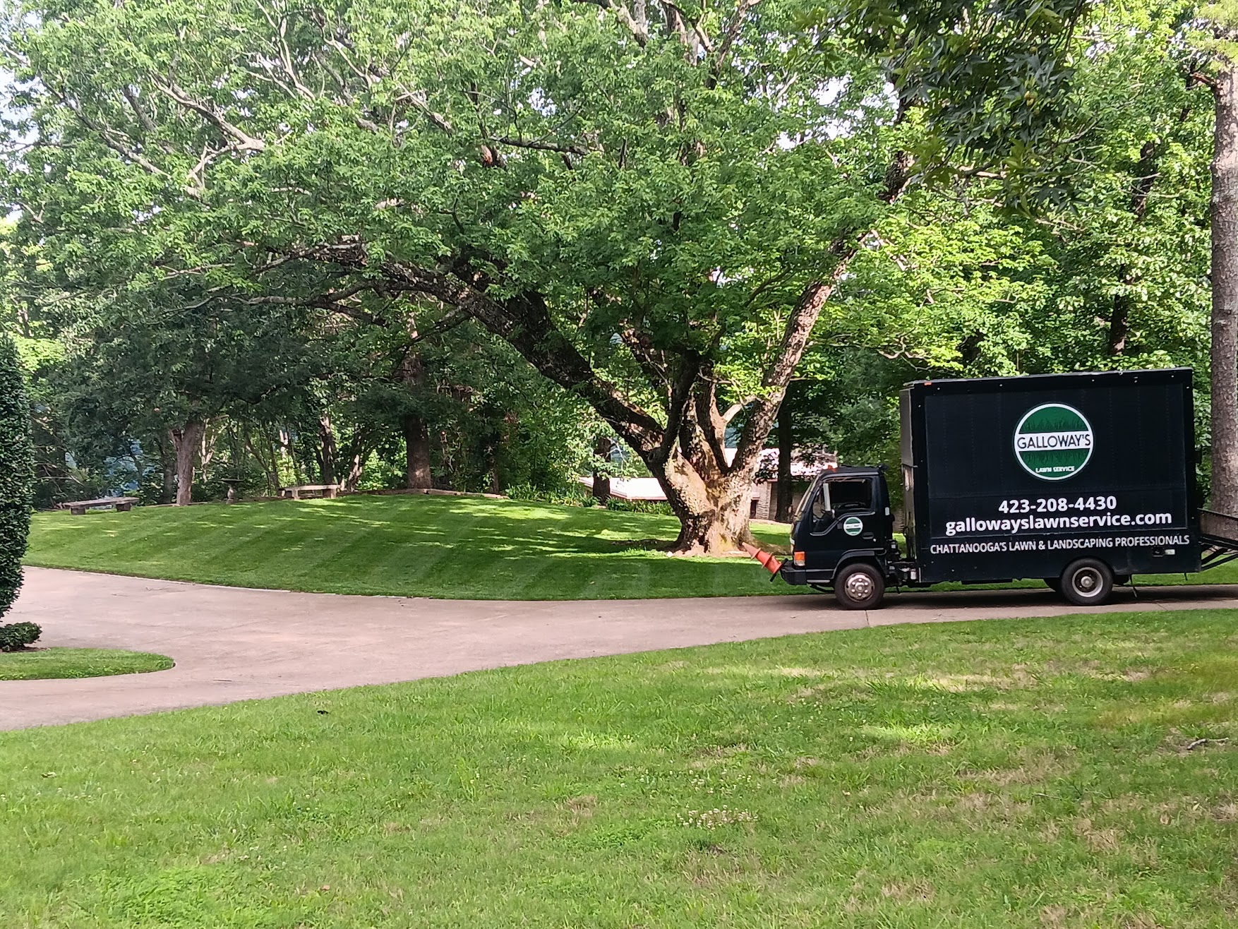 Galloway's Lawn service black box truck with a lush green commercial landscape.